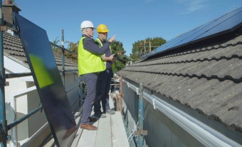 Engineers inspecting solar PV panels
