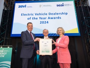 Winners of the ev dealership award receiving their award on stage at the Energy Show